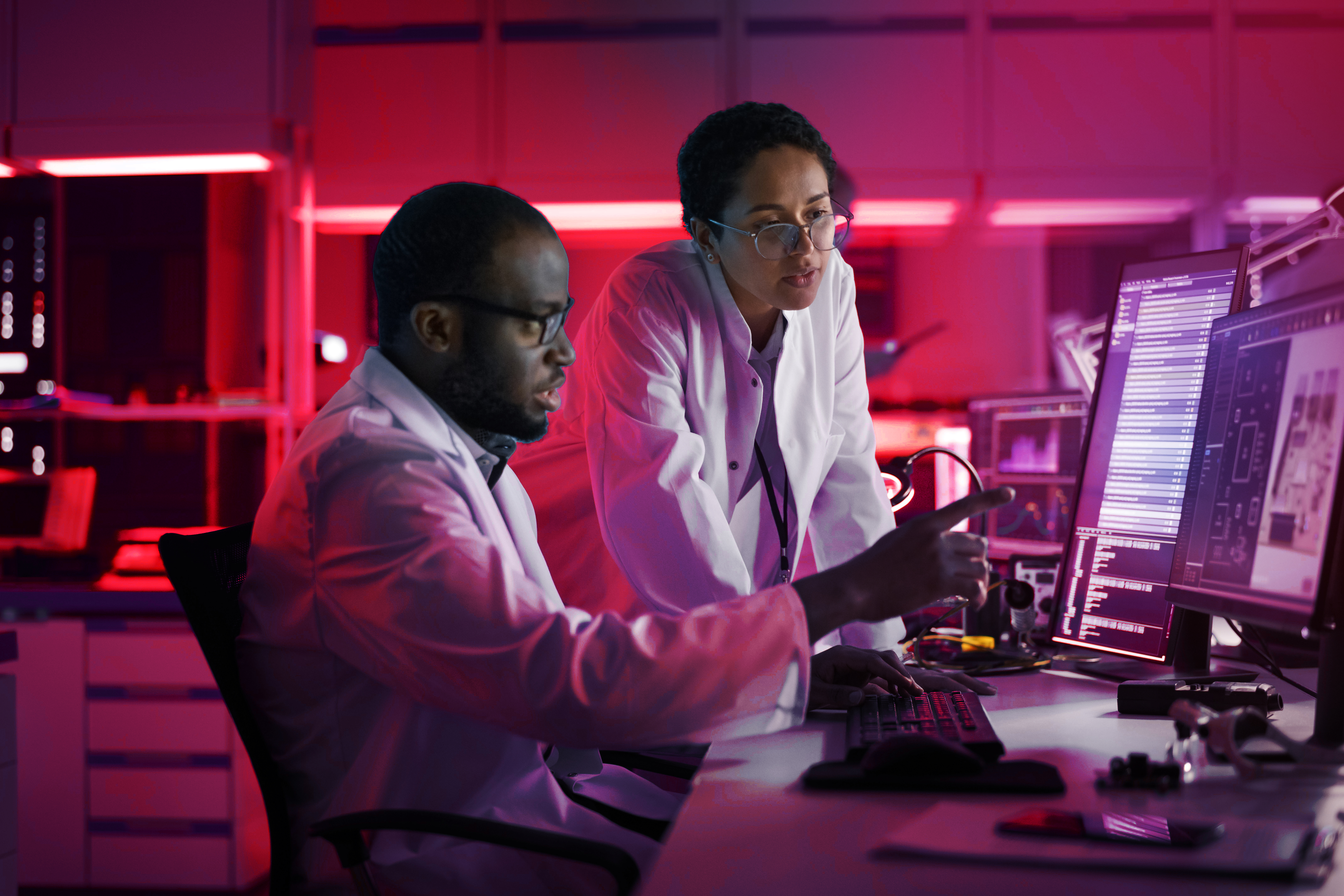 Two scientists at computer screen